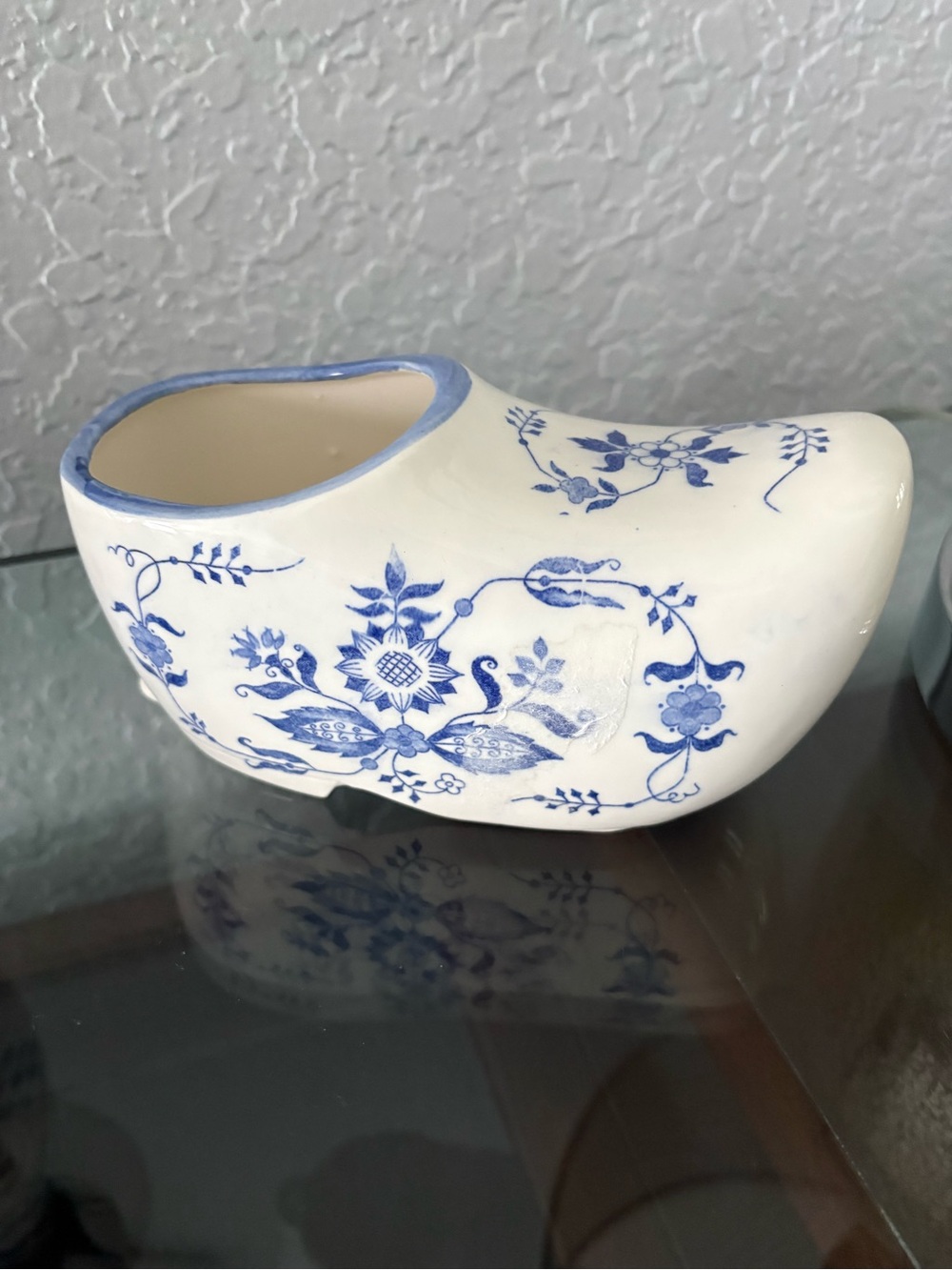 A vintage Delft Blue ceramic clog